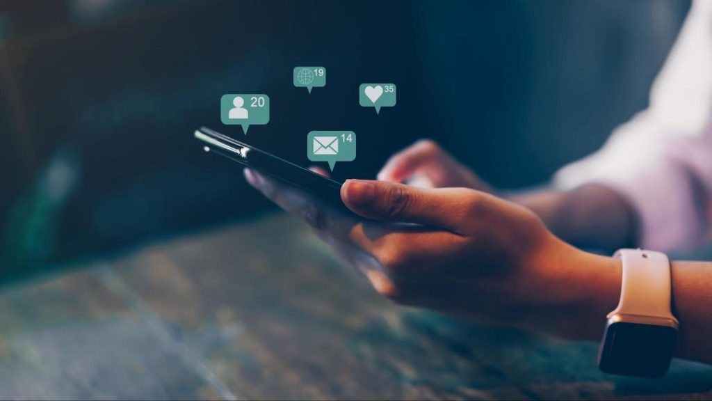 Engagement rate: person checking the notifications from their phone